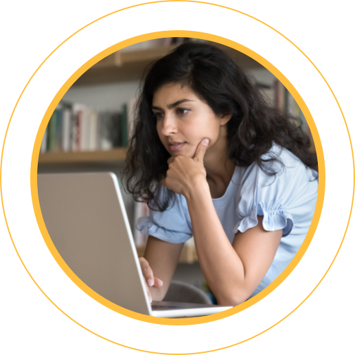 Crafting College Essays- student in thought at a laptop