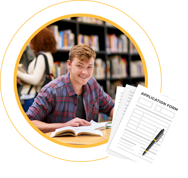 Managing Applications & Deadlines- male student smiling while studying in a library